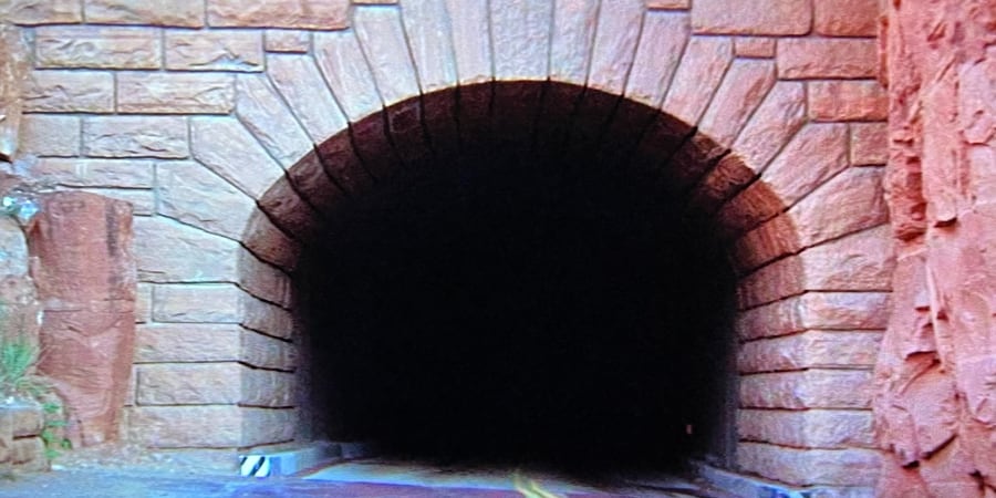 A tunnel in a mountain that will soon let loose... the car!