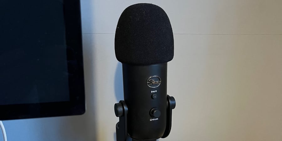 Phallic microphone looming over story dice.