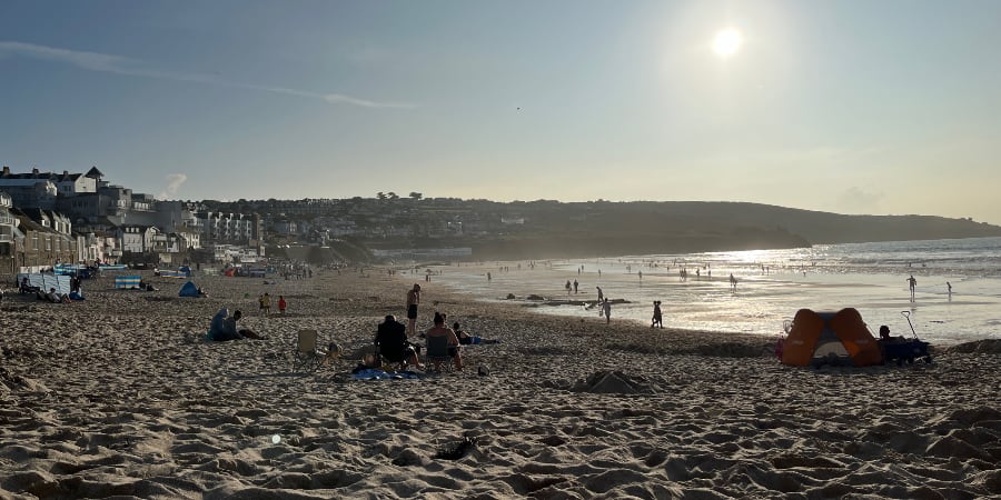 A beach with a setting sun