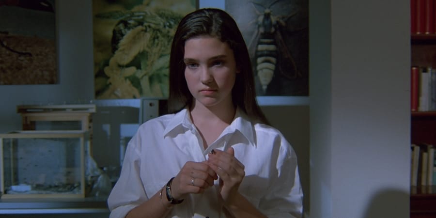 Jennifer stands in the lab of an entomologist
