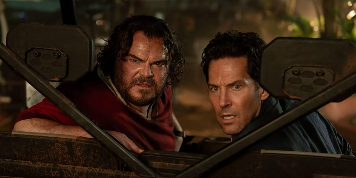 Two men looking back in horror at something slithery.