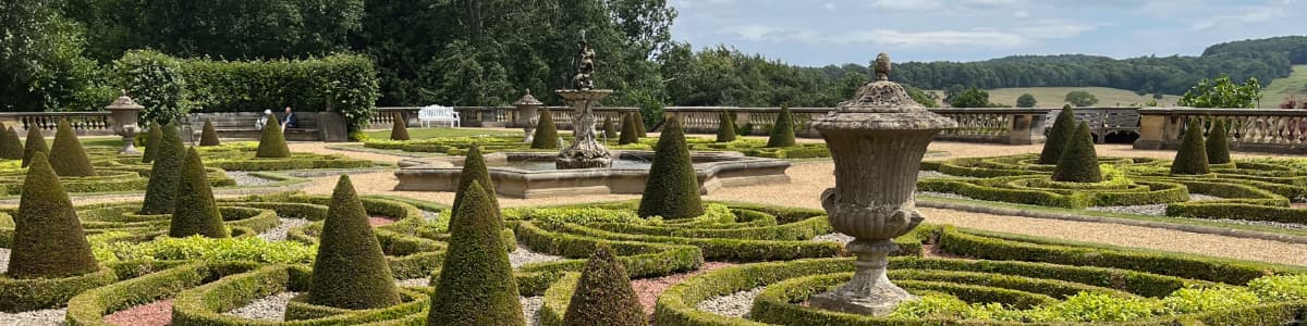An ornate garden at a mansion house in summer