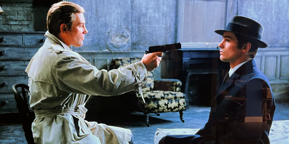 A man points a gun at another man.