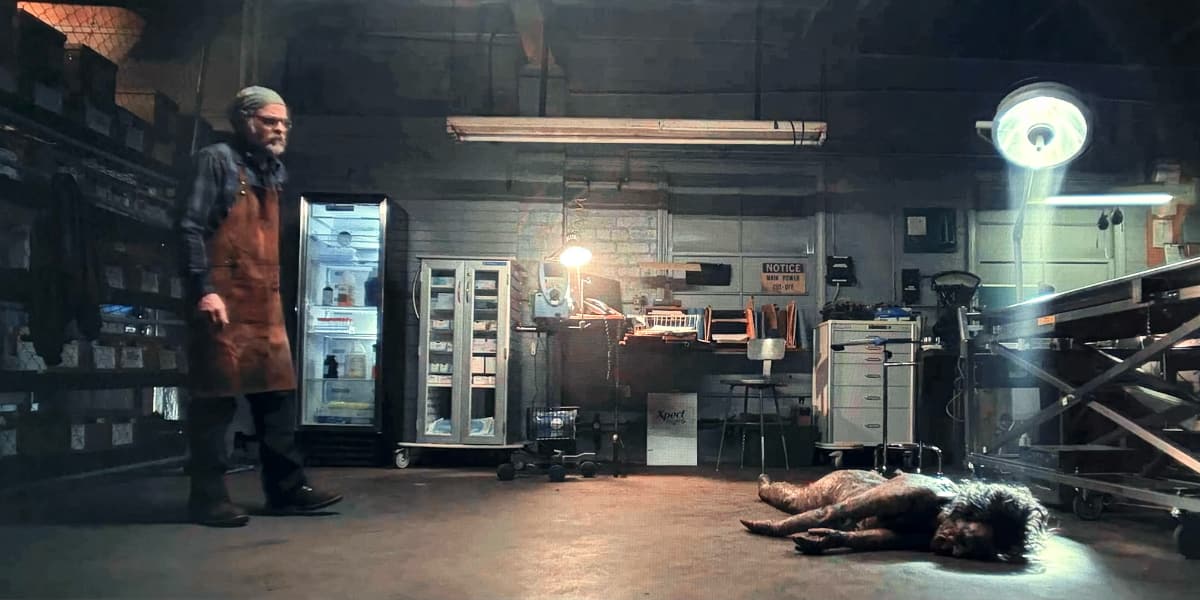 A pathologist is surprised by a body falling off his table.
